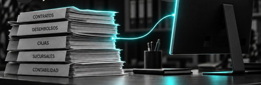 Carpetas de contratos, desembolsos, cajas y sucursales conectadas a una computadora